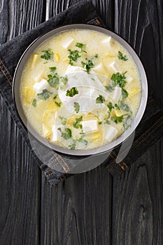Pisca AndinaÃÂ is a soup usually made with chicken broth, diced potatoes and eggs, then garnished with white cheese and cilantro photo